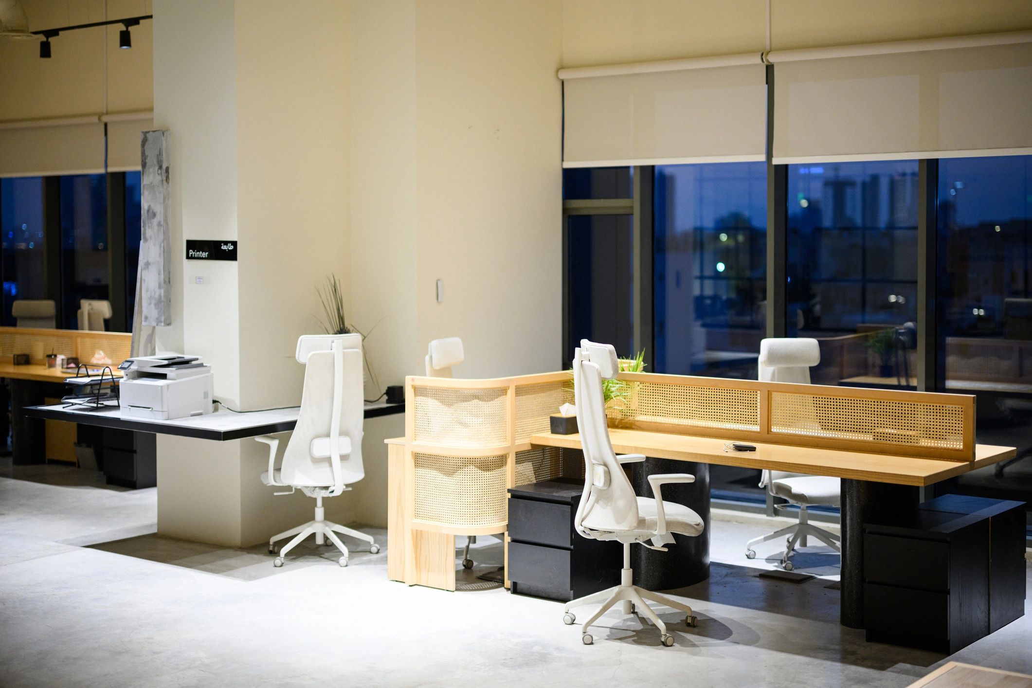 Modern office interior at night with city lights